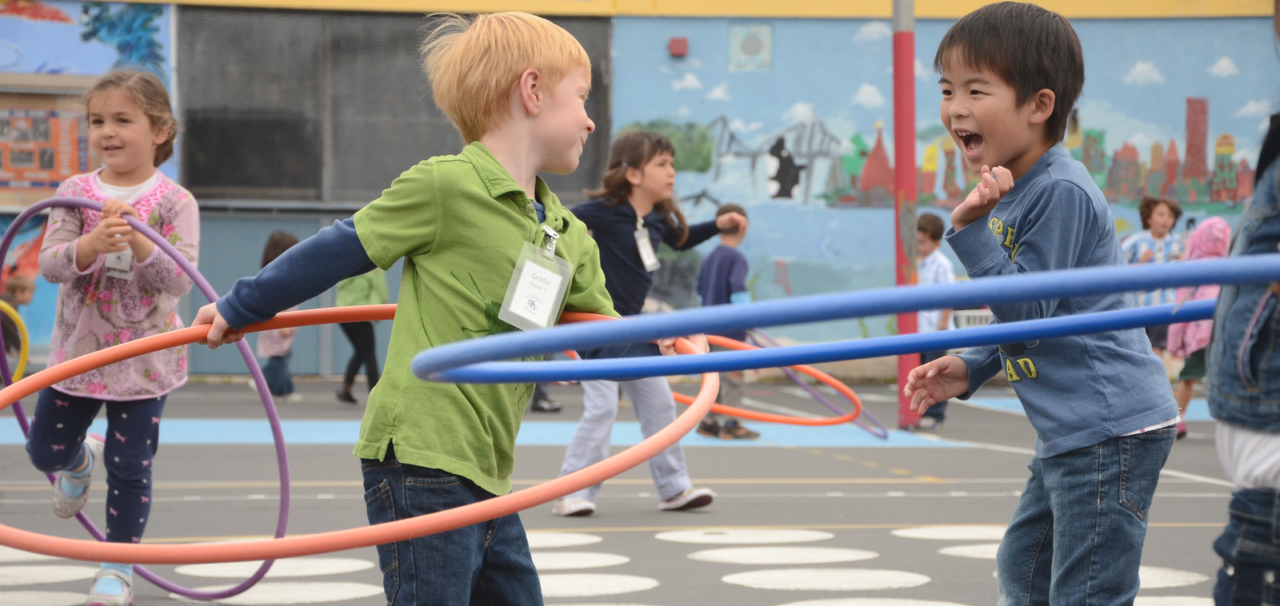 kids playing with hula hoops